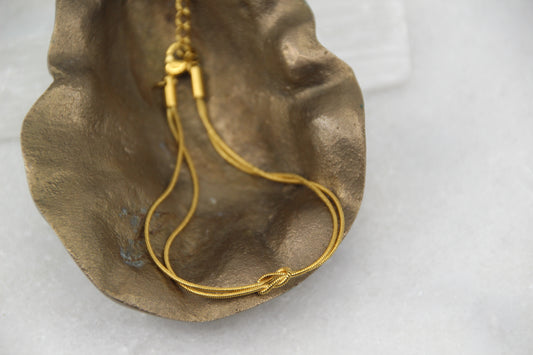 The Eclipse Wore Gold Knot Bracelet